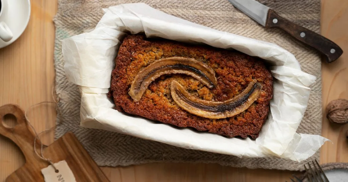 Freshly baked banana bread loaf made with two bananas.