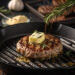 Garlic butter melting over a hot burger patty