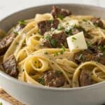 creamy one pot beef and garlic butter pasta in a bowl
